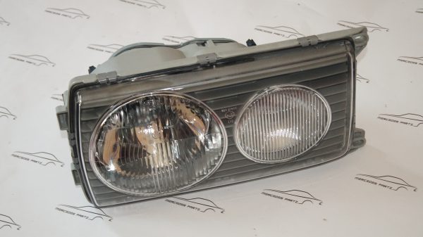 W123 Left Hella headlight Genuine Mercedes Part 1238204161