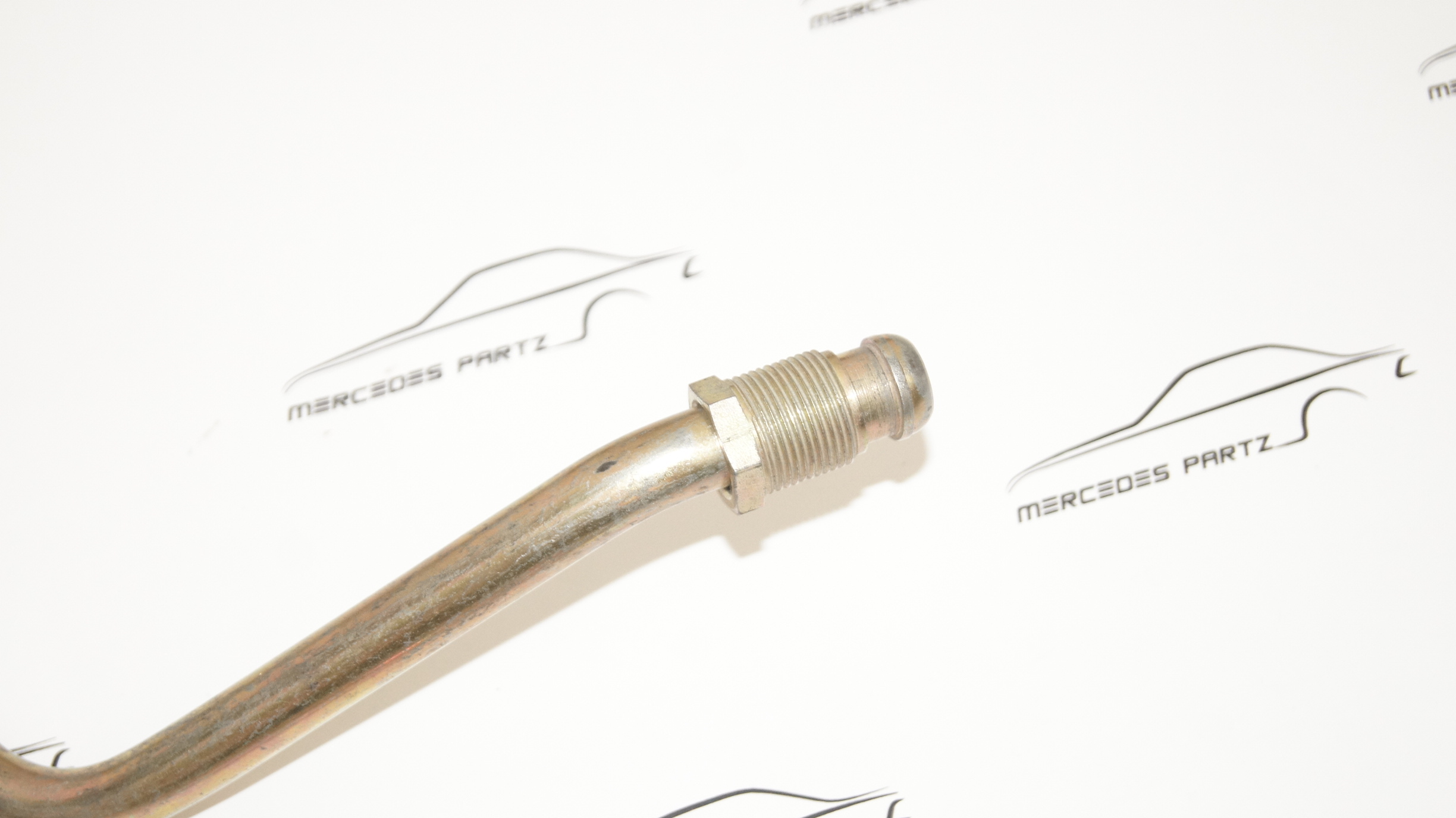 M110 oil cooler to oil filter hose A1101871482 Genuine Mercedes Part M110 oil cooler to oil filter hose A1101871482 Genuine Mercedes Part