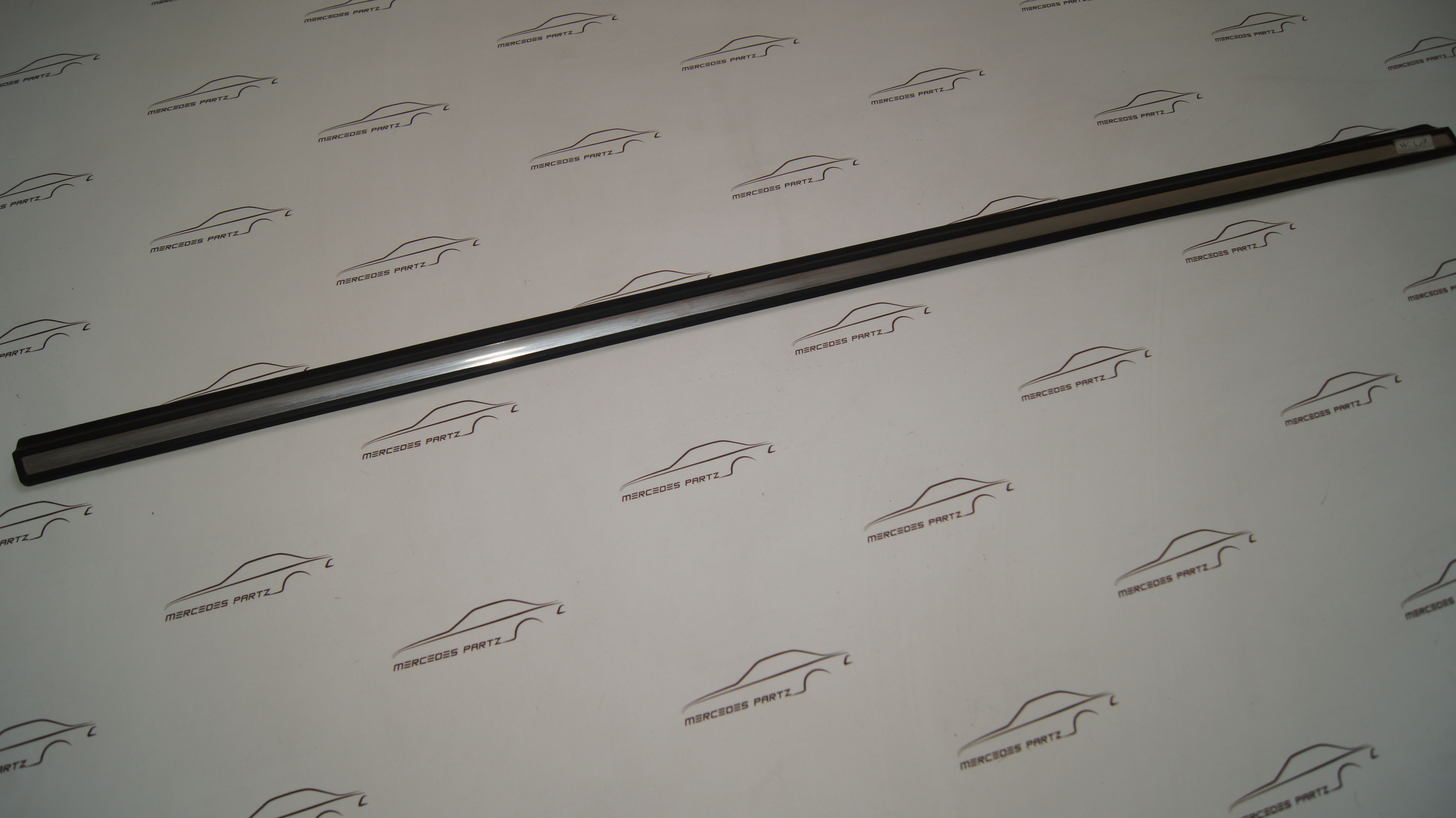 W123 front door bottom left garnish moulding Genuine Mercedes Part W123 front door bottom left garnish moulding Genuine Mercedes Part
