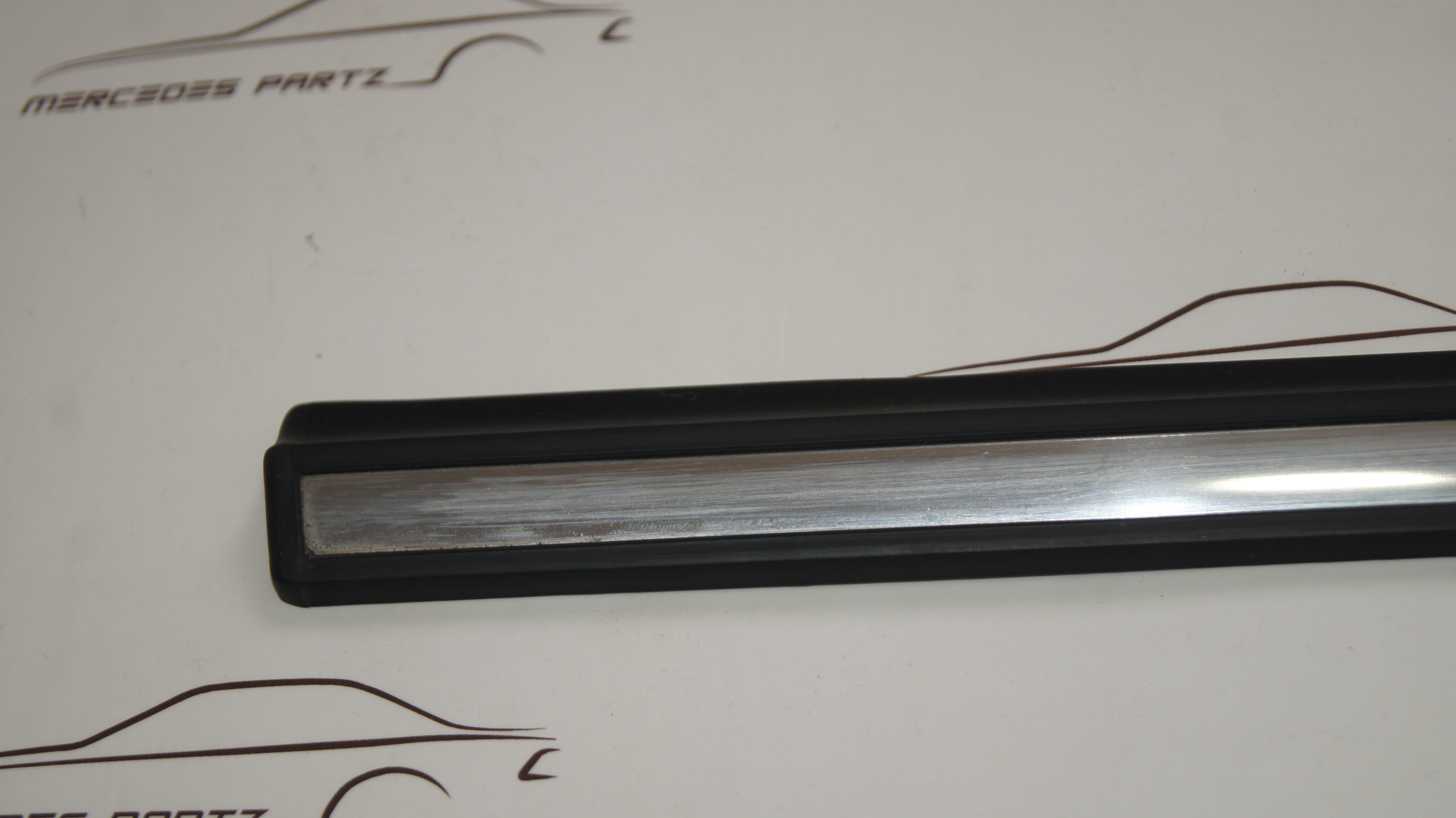 W123 front door bottom left garnish moulding Genuine Mercedes Part W123 front door bottom left garnish moulding Genuine Mercedes Part