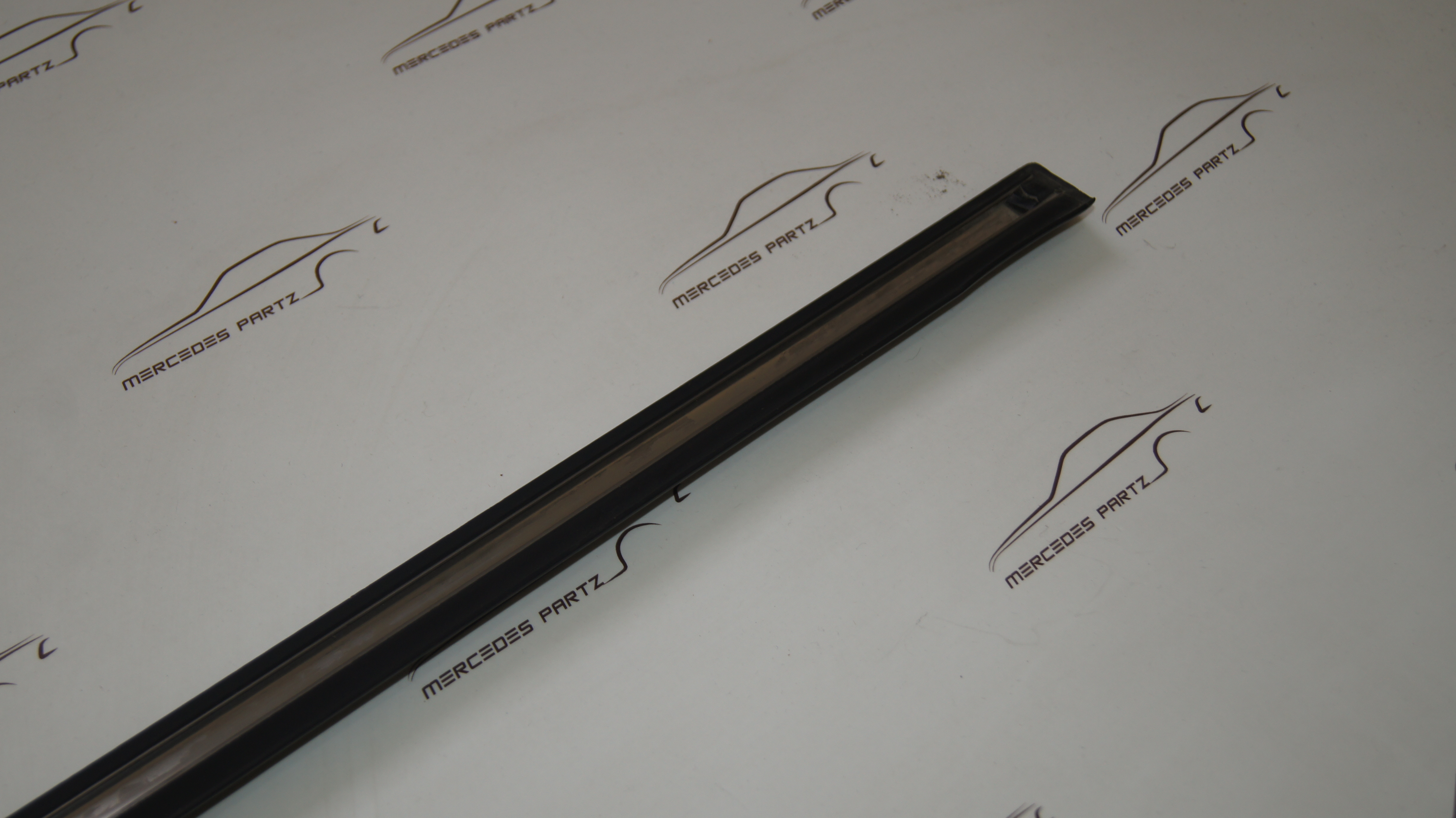 W123 front door bottom left garnish moulding Genuine Mercedes Part W123 front door bottom left garnish moulding Genuine Mercedes Part