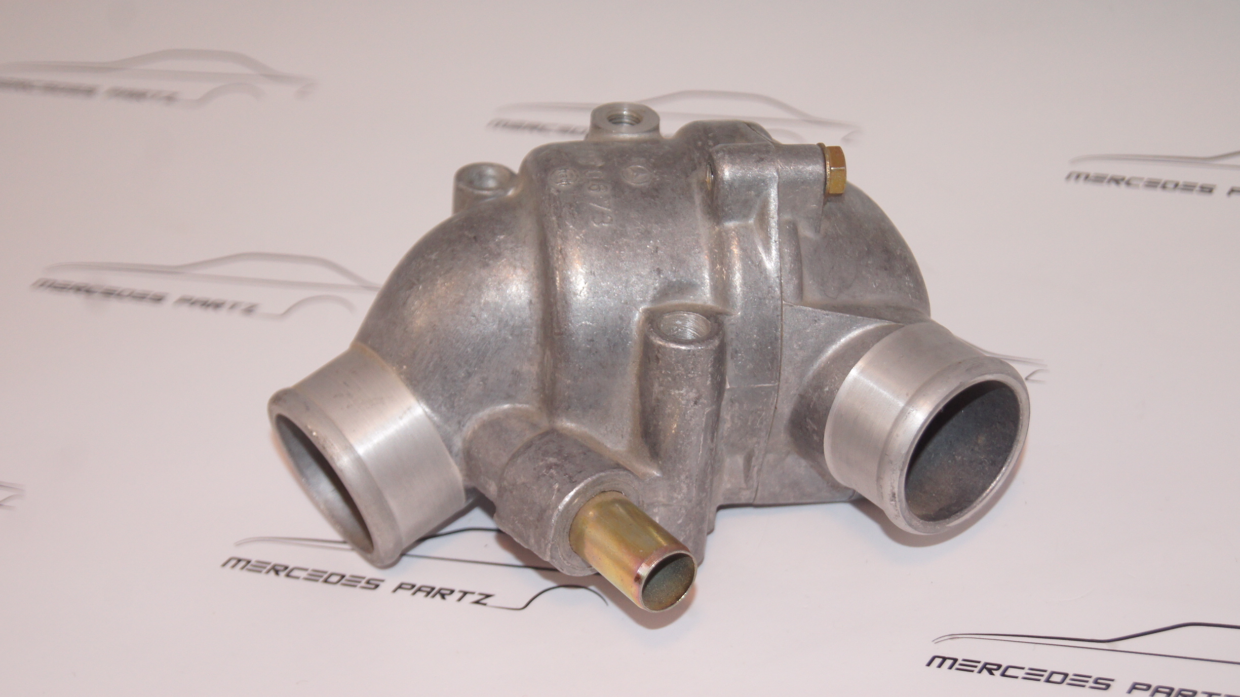M110 thermostat housing with thermostat NEW NOS A1102030574 Genuine Mercedes Part