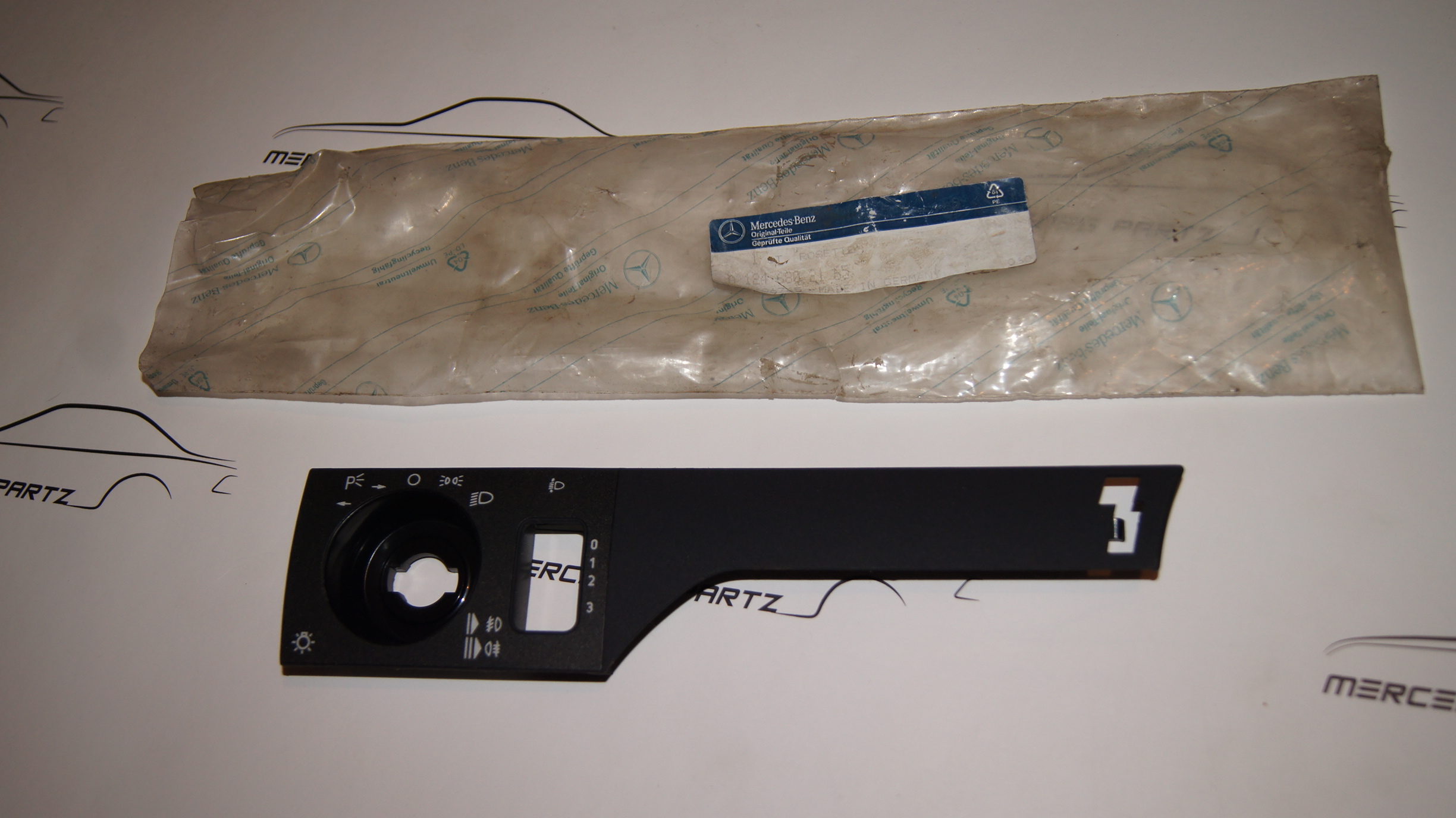 W124 light rotary switch escutcheon cover plate for adjustable steering NEW NOS A1246802165 Genuine Mercedes Part W124 light rotary switch escutcheon cover plate for adjustable steering NEW NOS A1246802165 Genuine Mercedes Part